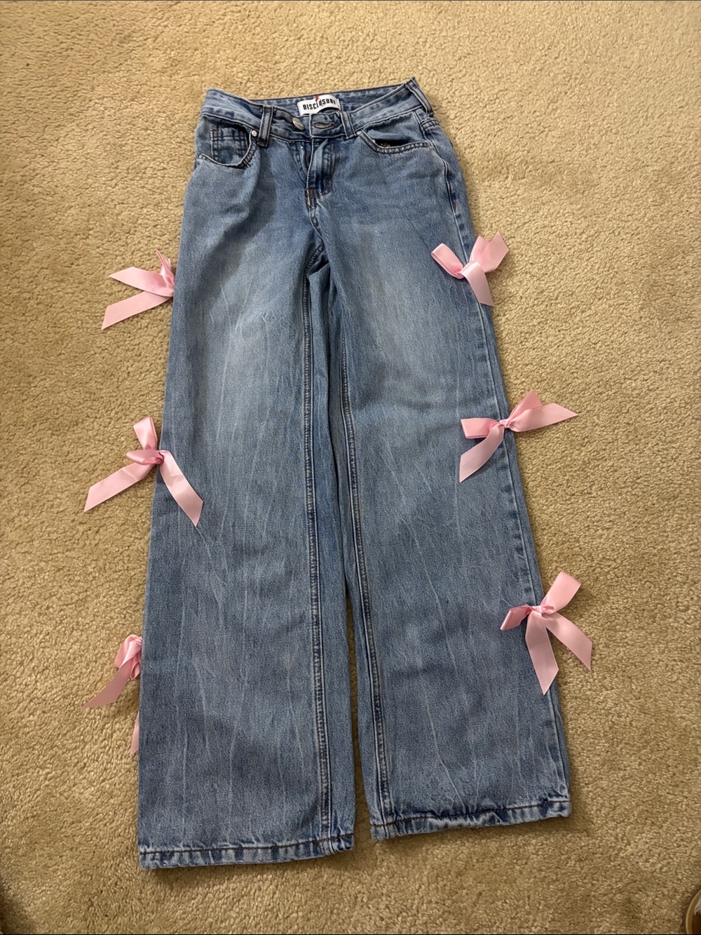 Light Blue Wide-Leg Jeans with Pink Ribbon Details